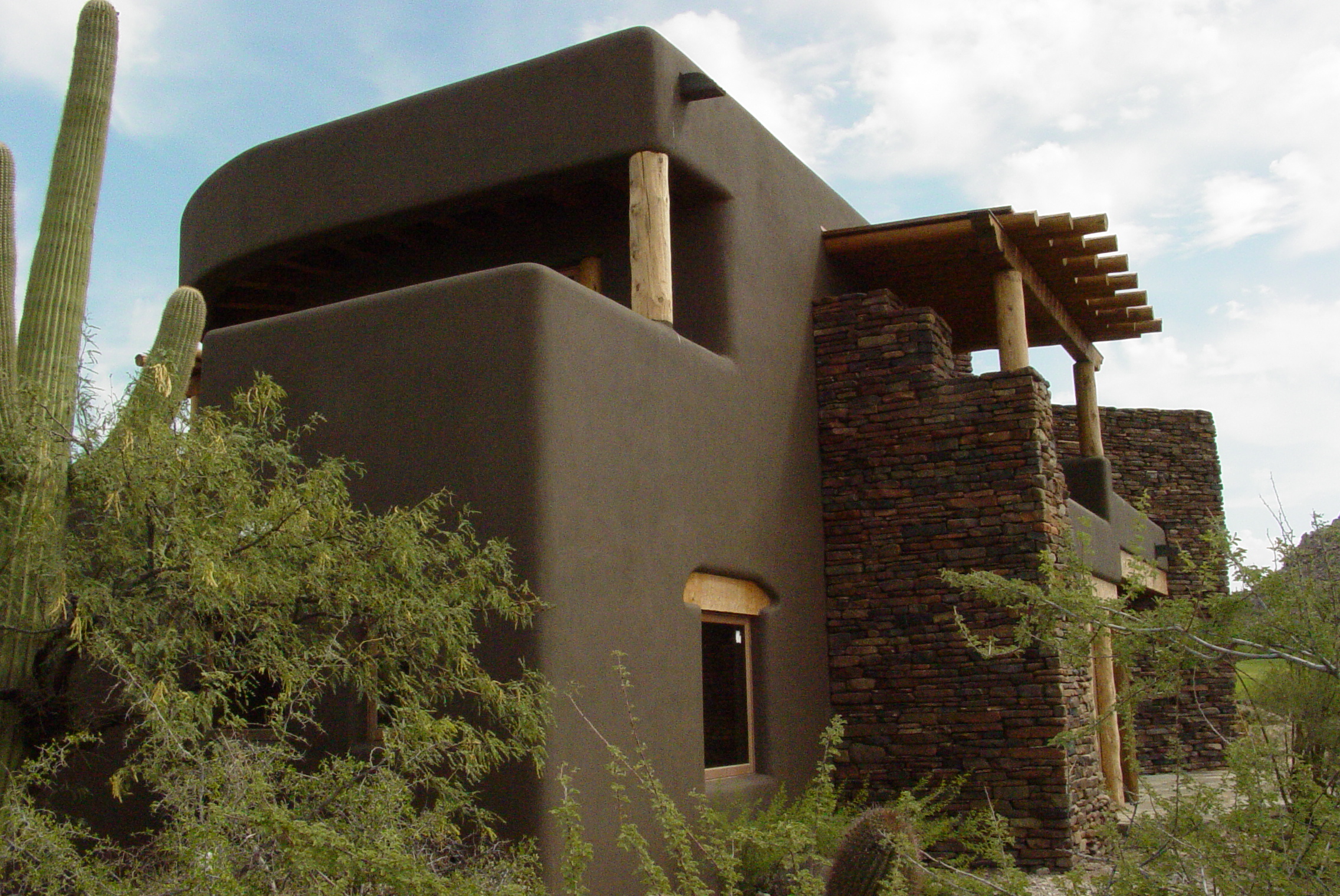 adobe stone and wood house exterior image