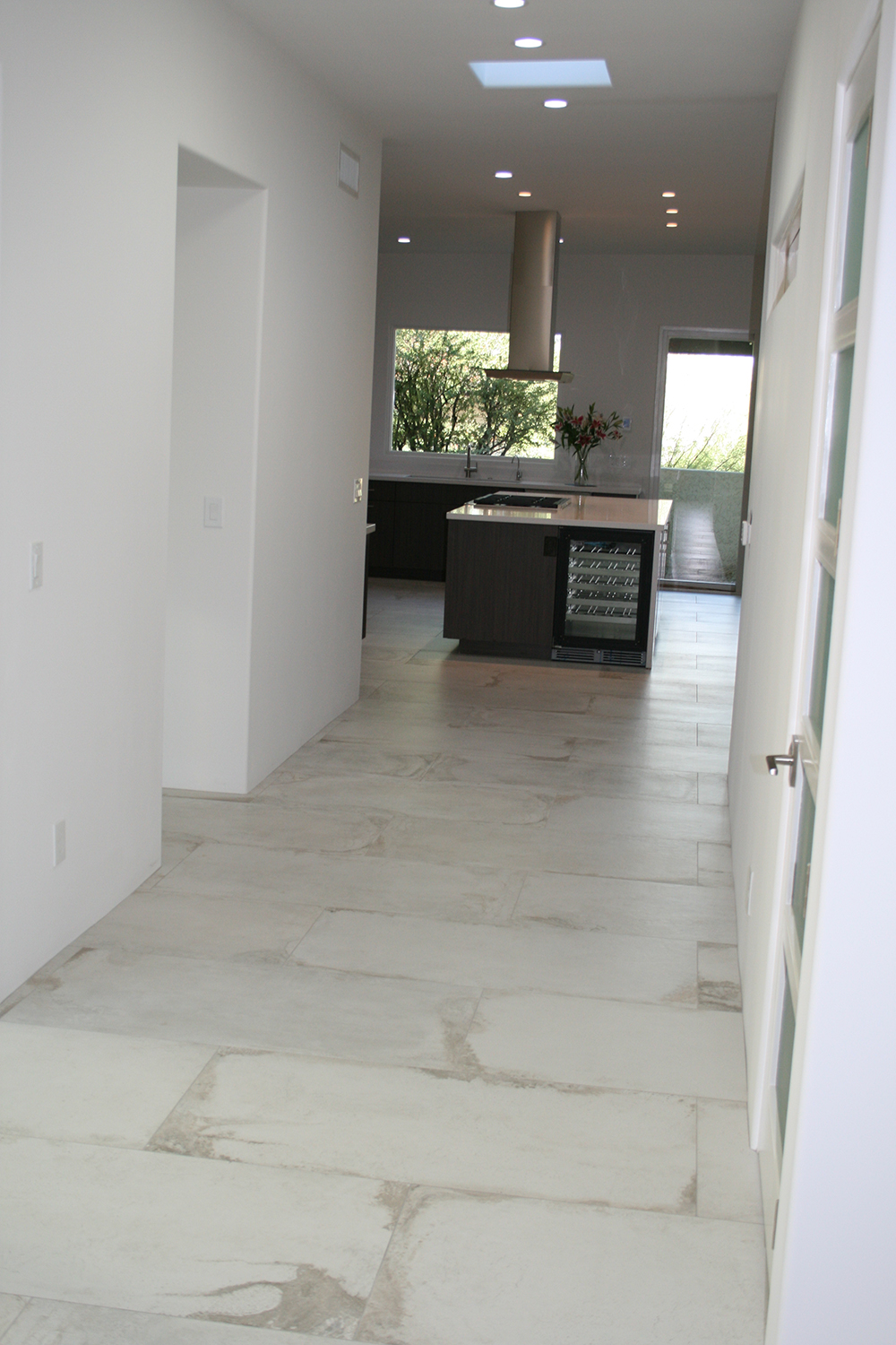 white tile hallway image